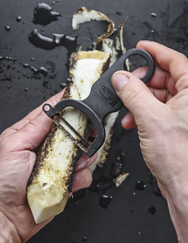Peeling burdock roots with a Kuhn Rikon peeler. 