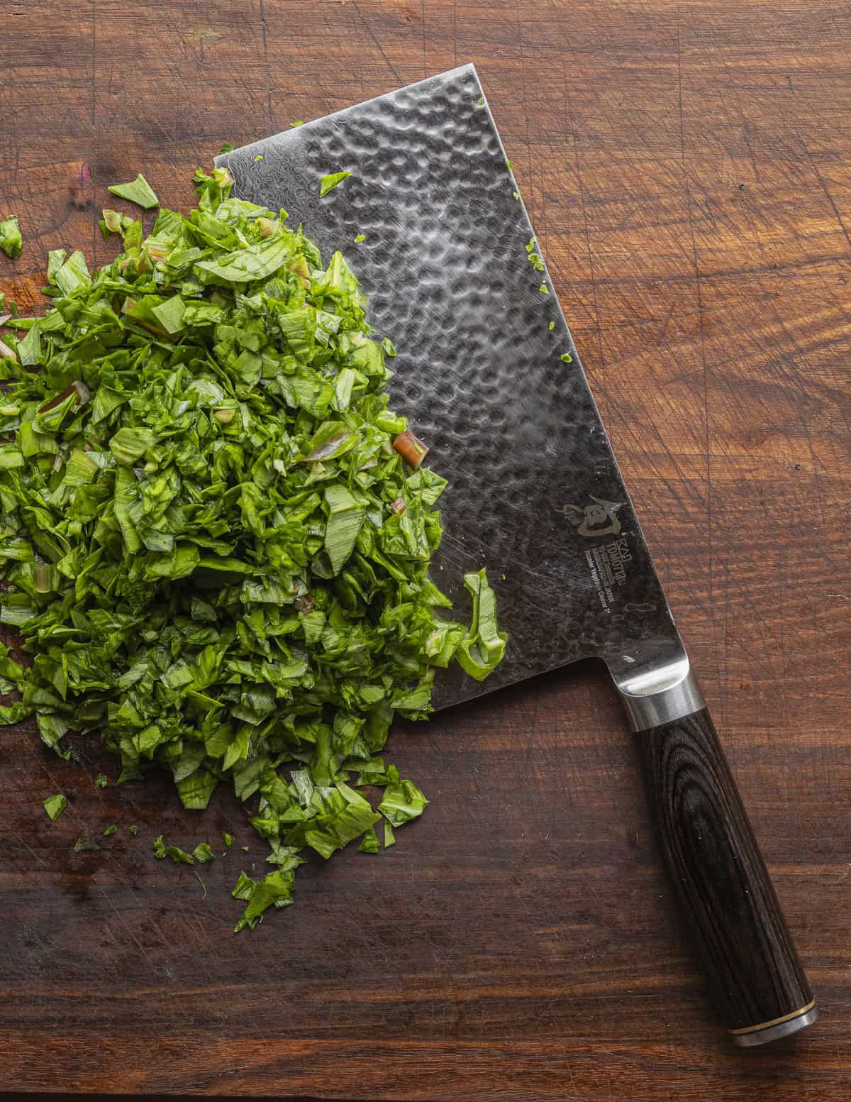 Finely chopping ramp leaves. 