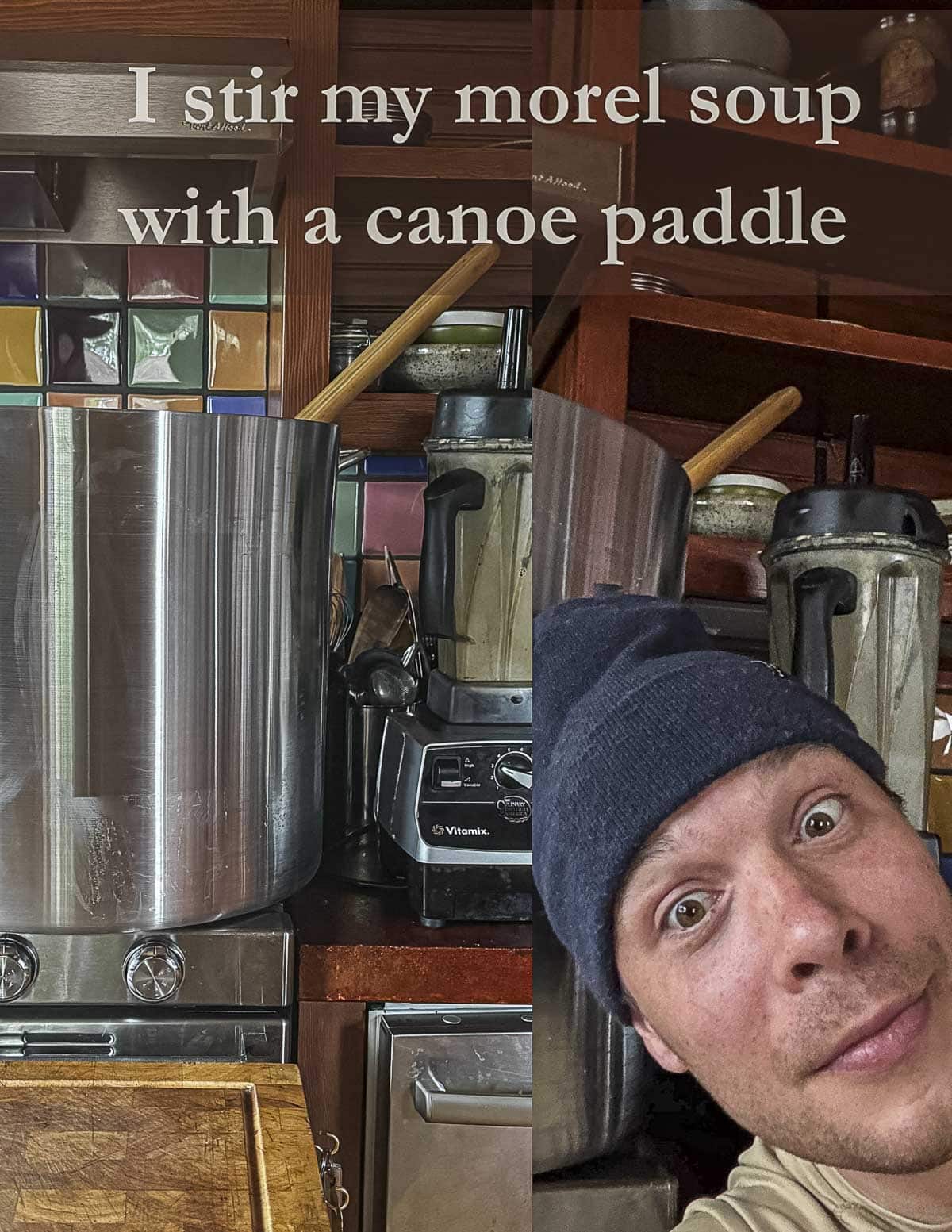 Alan Bergo standing next to a very large pot of morel mushroom soup. 
