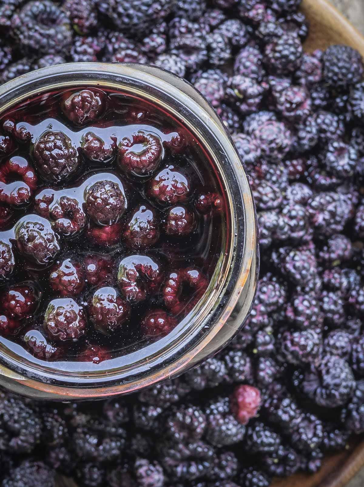 A jar of homemade raspberry vinegar made with black raspberries. 