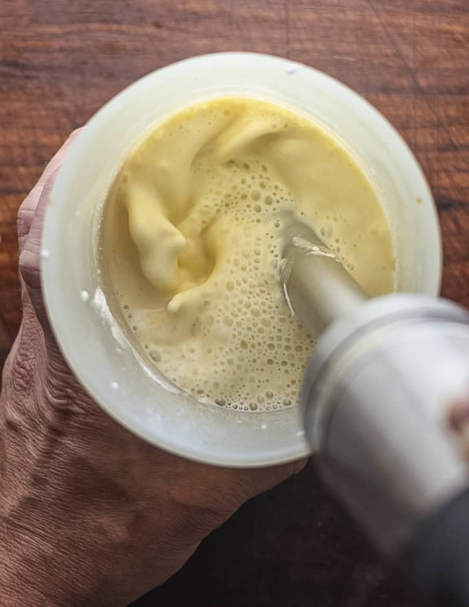 Pureeing clafoutis batter with a hand blender. 