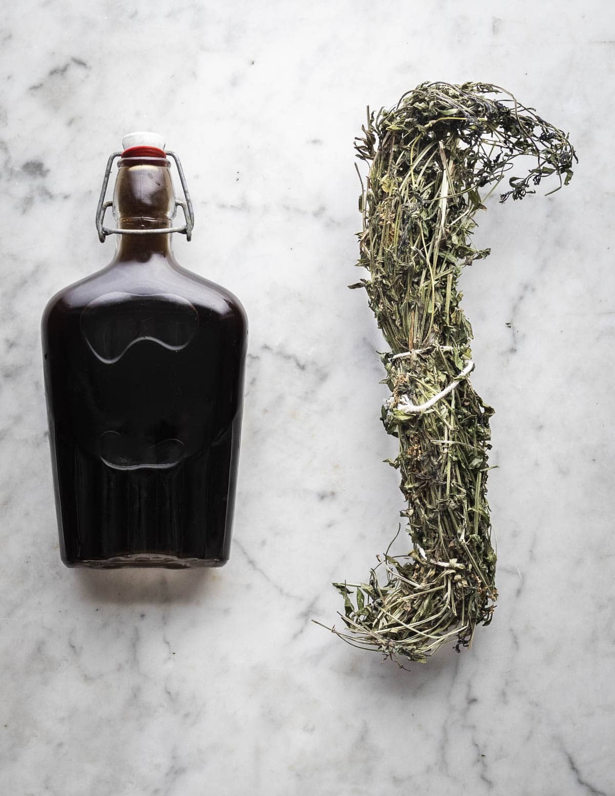 A jar of homemade vanilla extract made using Galium triflorum plants. 