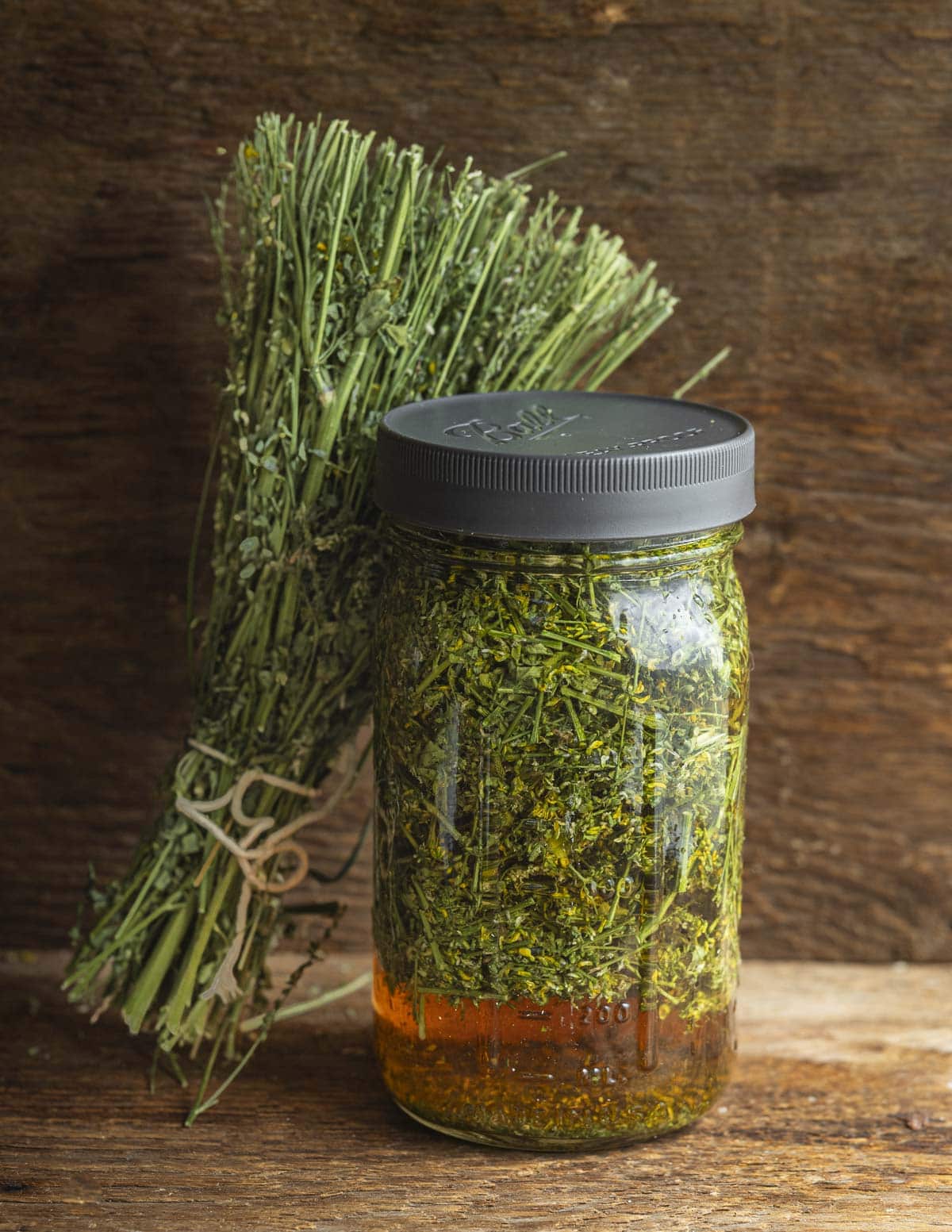 A jar of homemade vanilla extract made from dried sweet clover. 