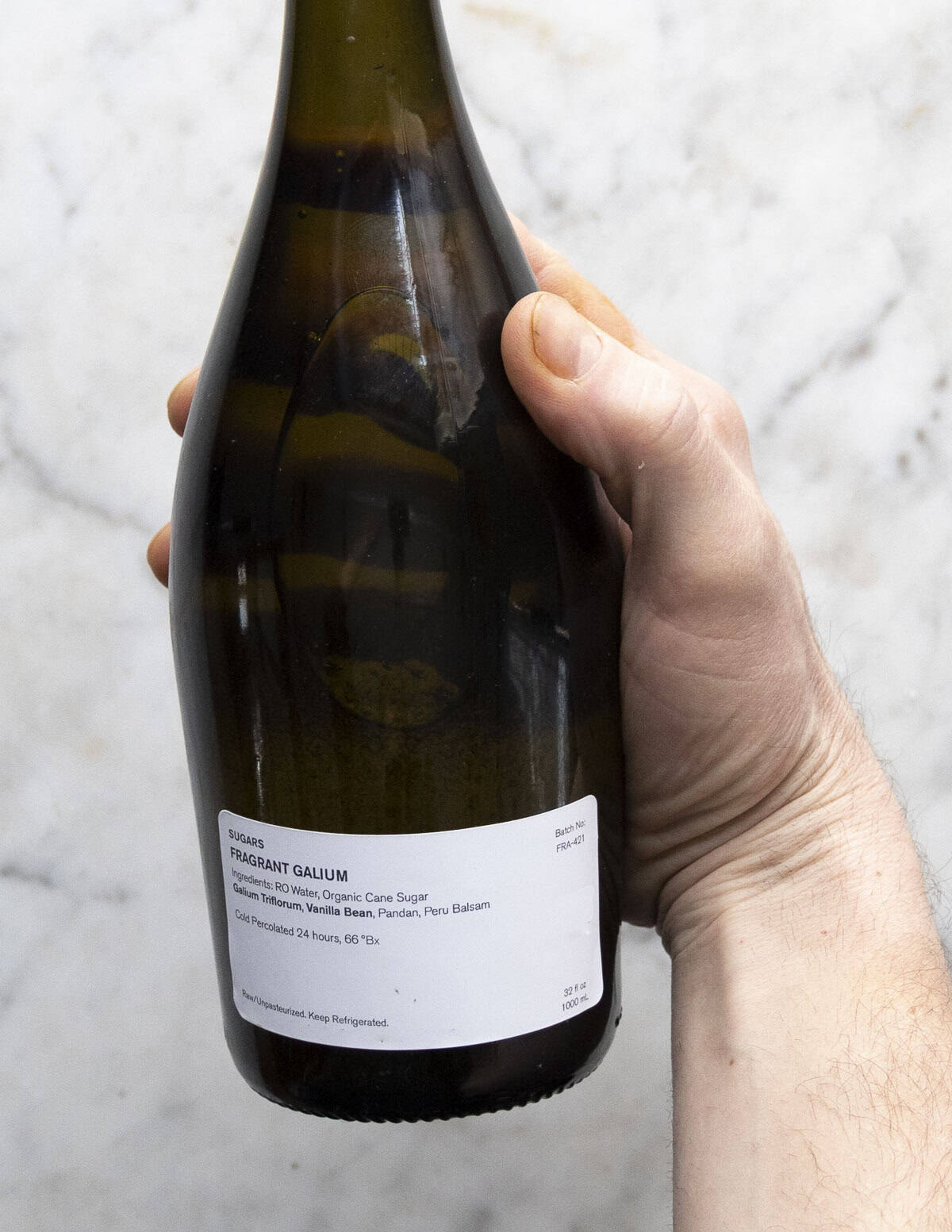 A bottle of sweet scented Galium extract. 