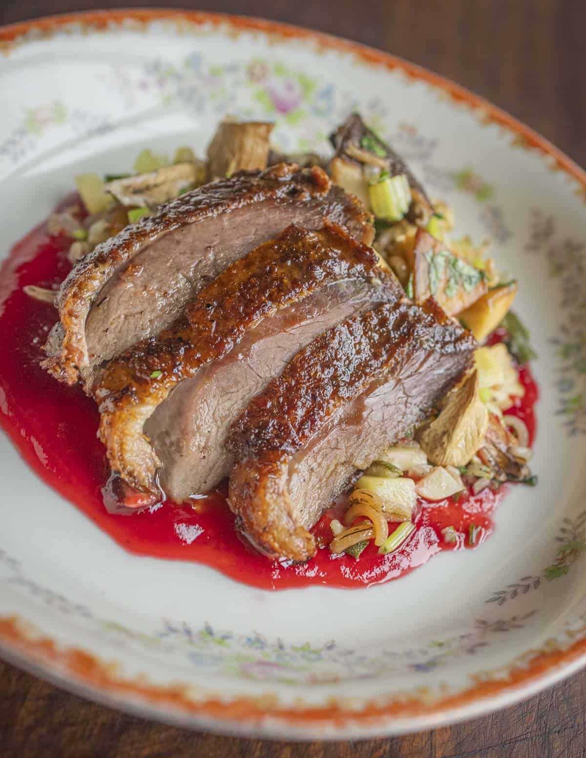 Roasted goose with mushroom wild rice, butternuts and highbush cranberry sauce. 
