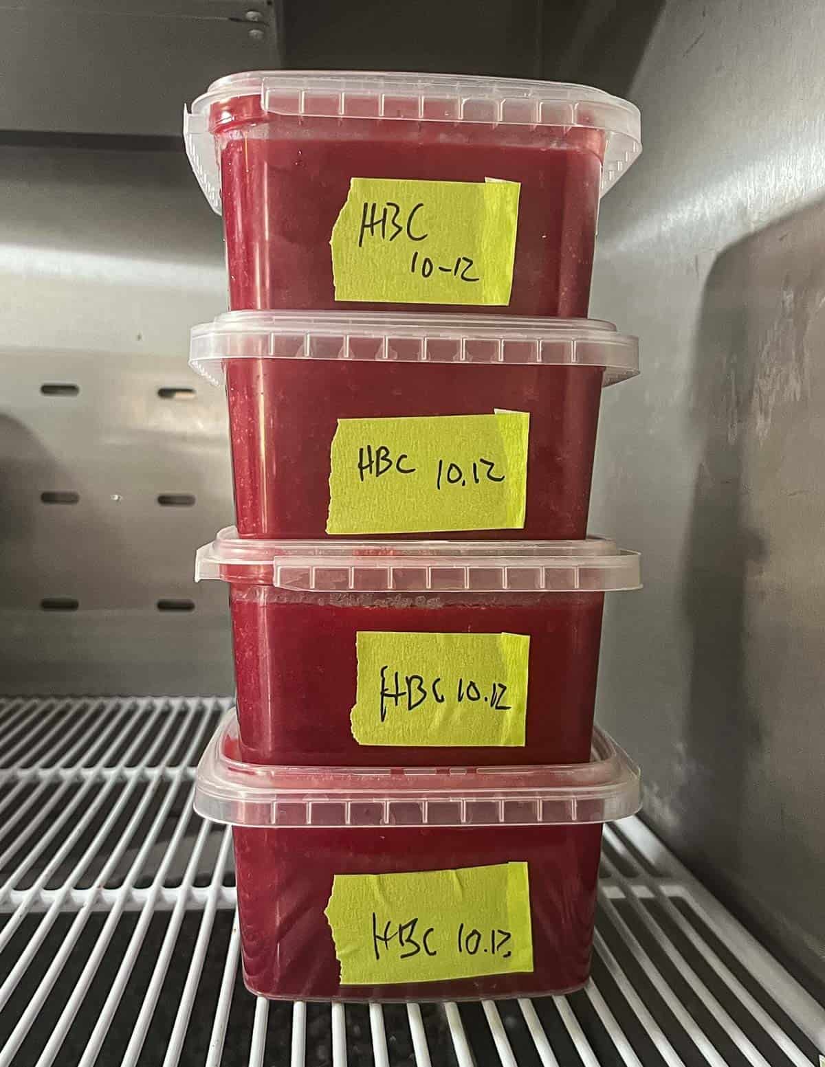 A stack of frozen highbush cranberry puree in a freezer. 