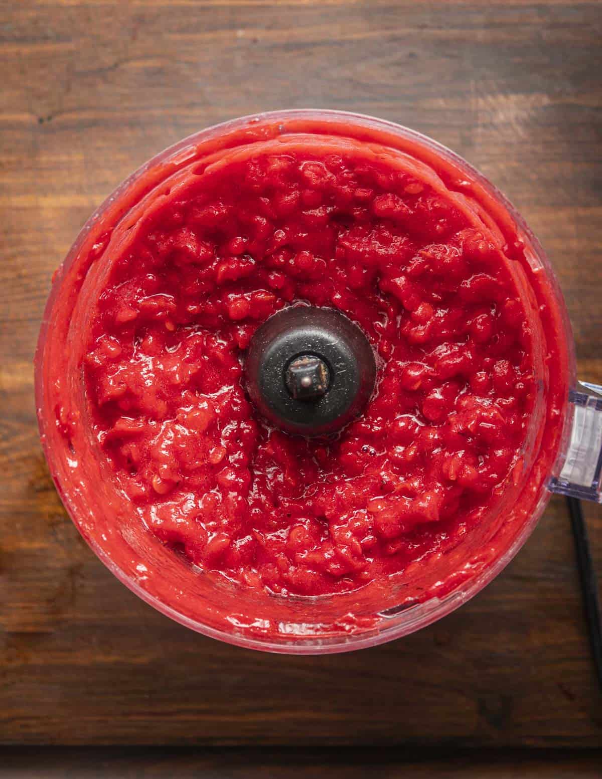 Ripe highbush cranberries pureed with water in a food processor. 