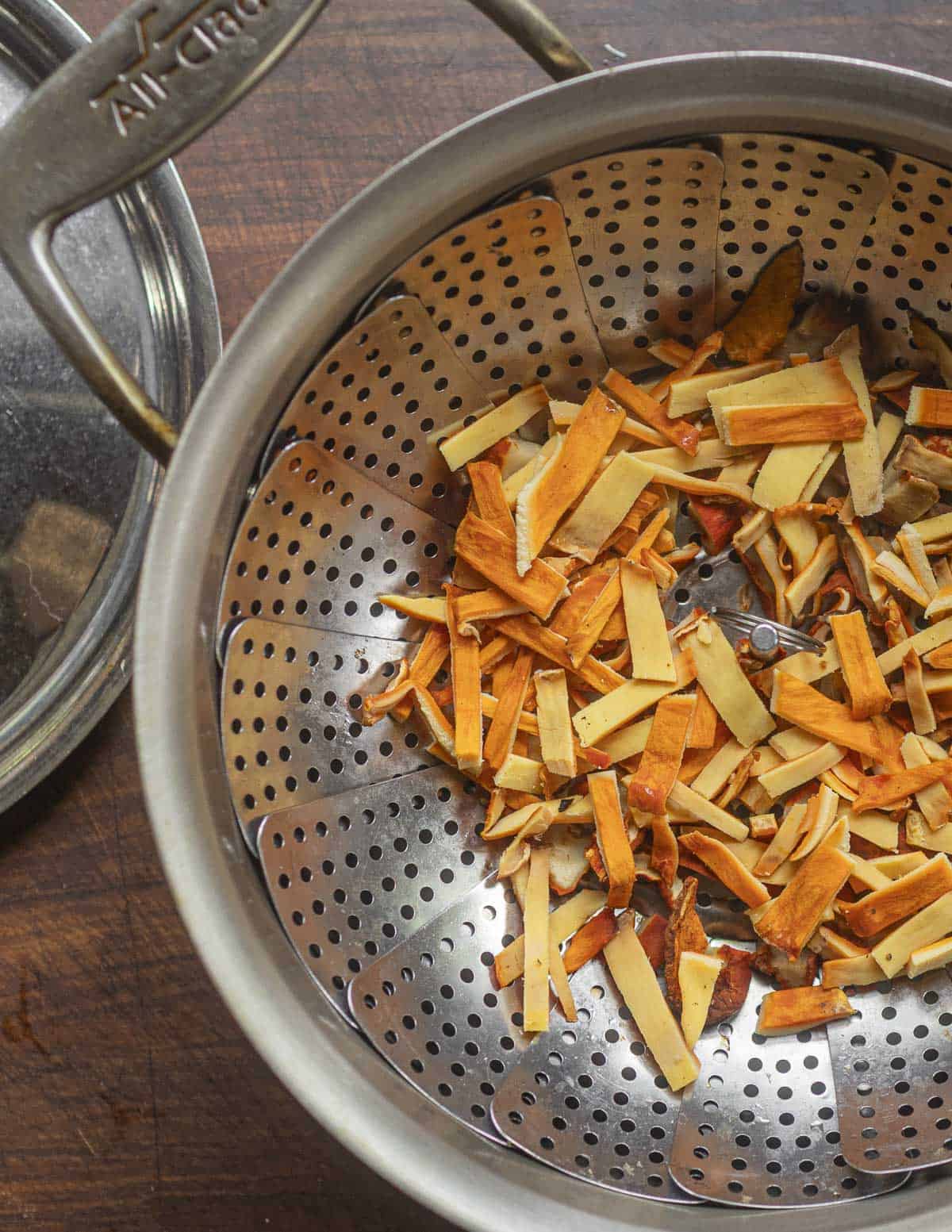 A steamer basket filled with chicken of the woods mushrooms. 
