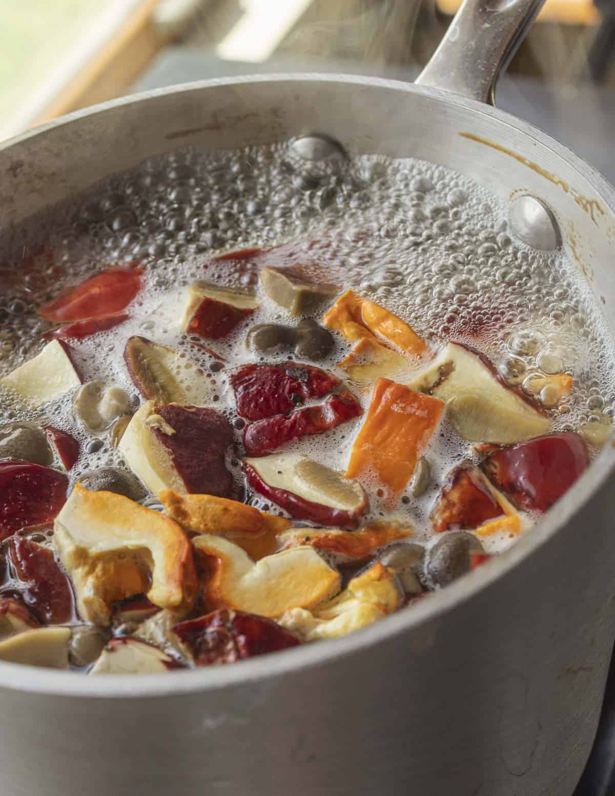 Boiling wild mushrooms in a pot of salted water. 