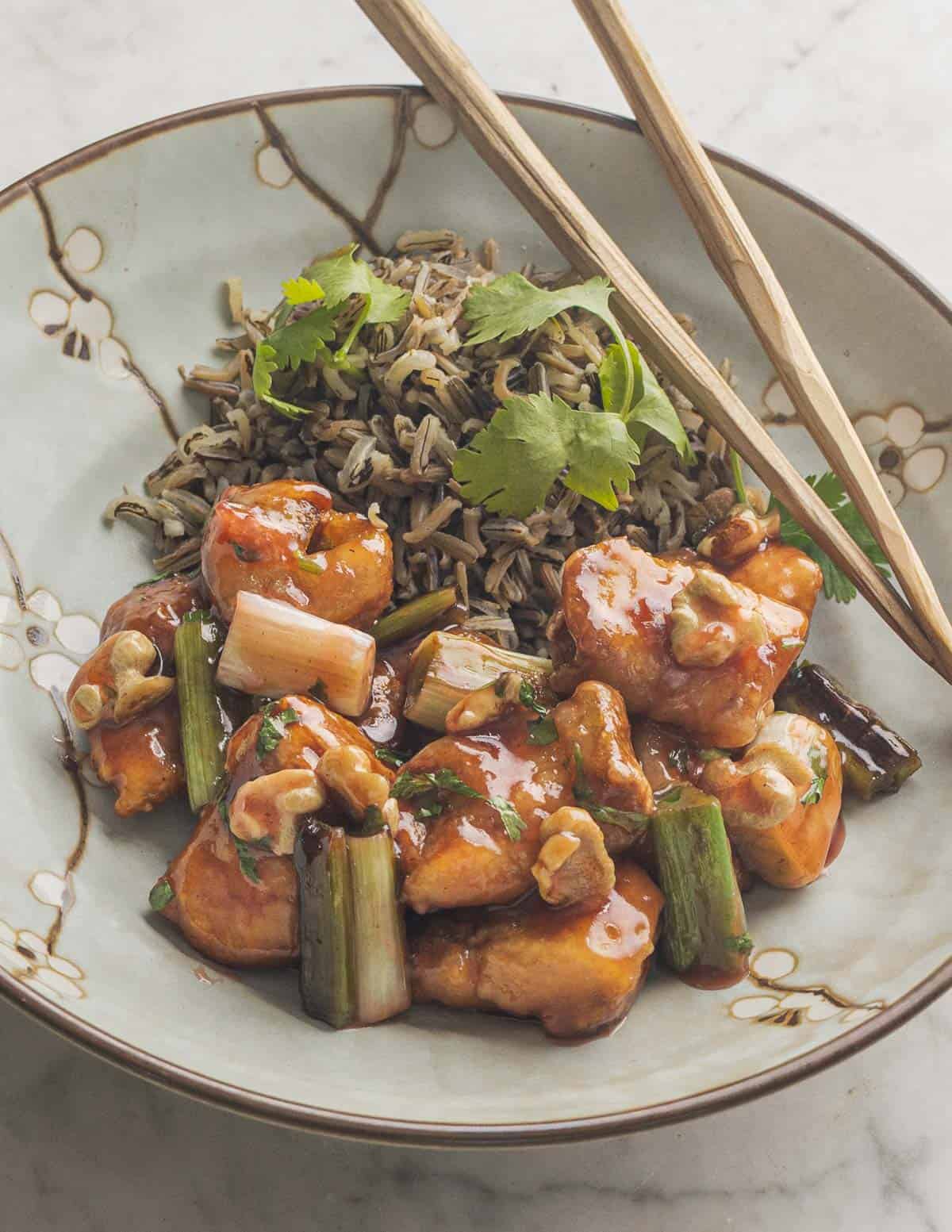 A large plate of sweet and sour deep fried puffball mushrooms with wild rice and black walnuts.