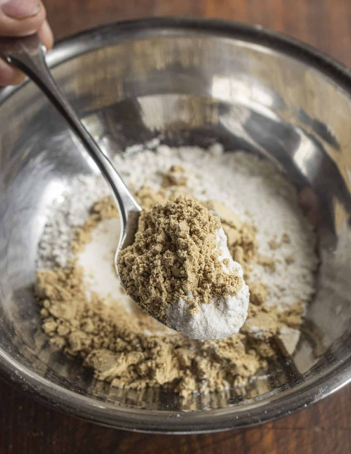 mixing dry ingredients for banana walnut pancakes
