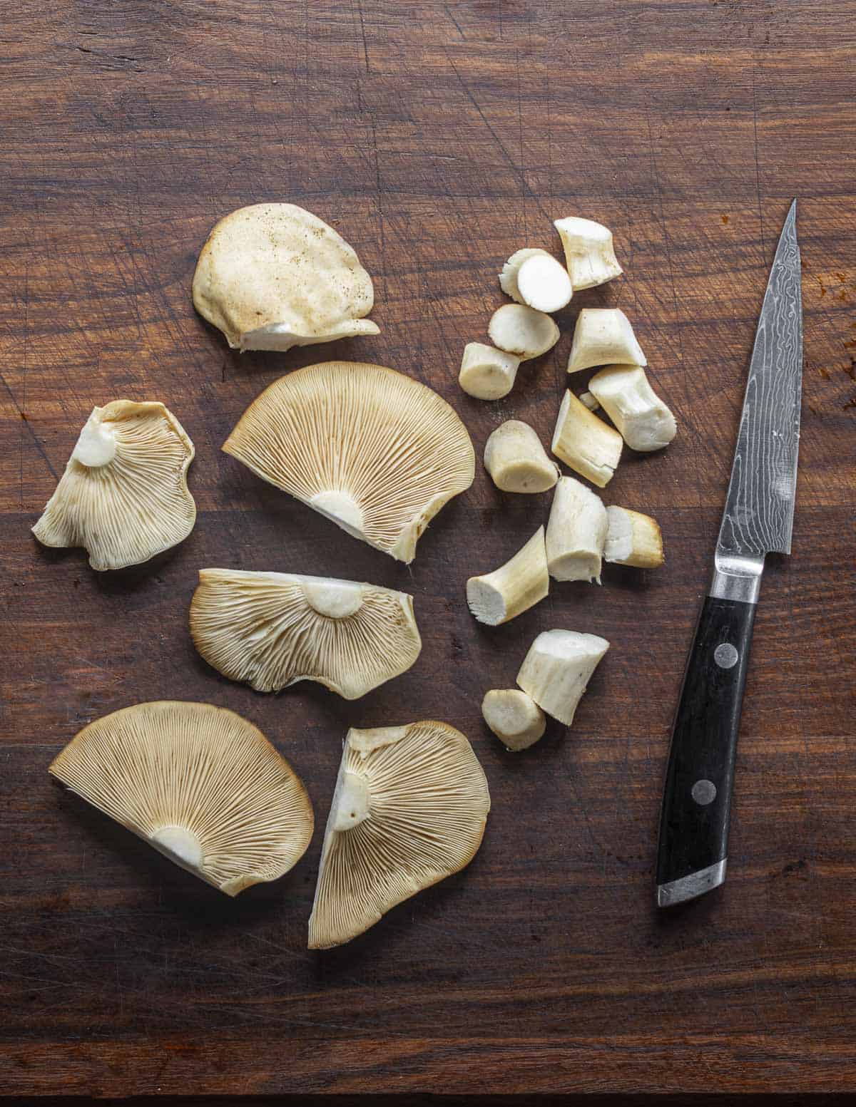 Cutting fried chicken mushrooms into bite sized pieces. 