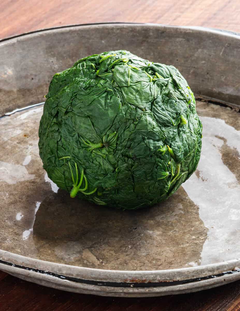 A ball of blanched, chilled common mallow greens ready to cook.
