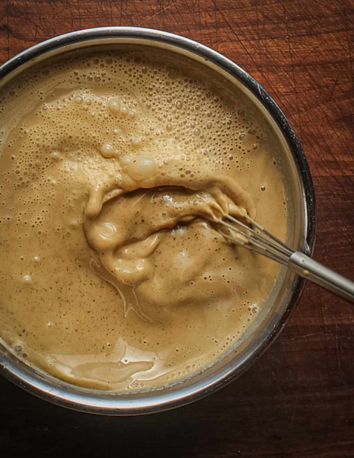 Whisking dandelion coffee ice cream base before spinning.