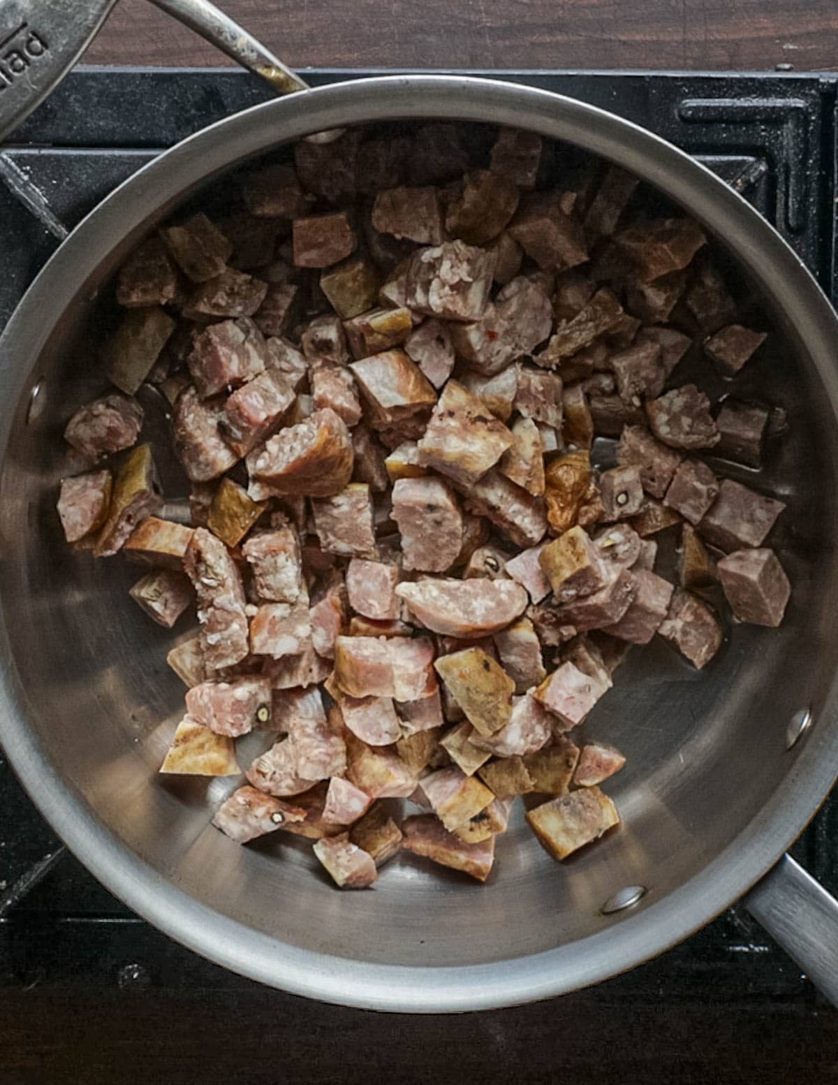 Browning Italian sausage in a pot to make soup.
