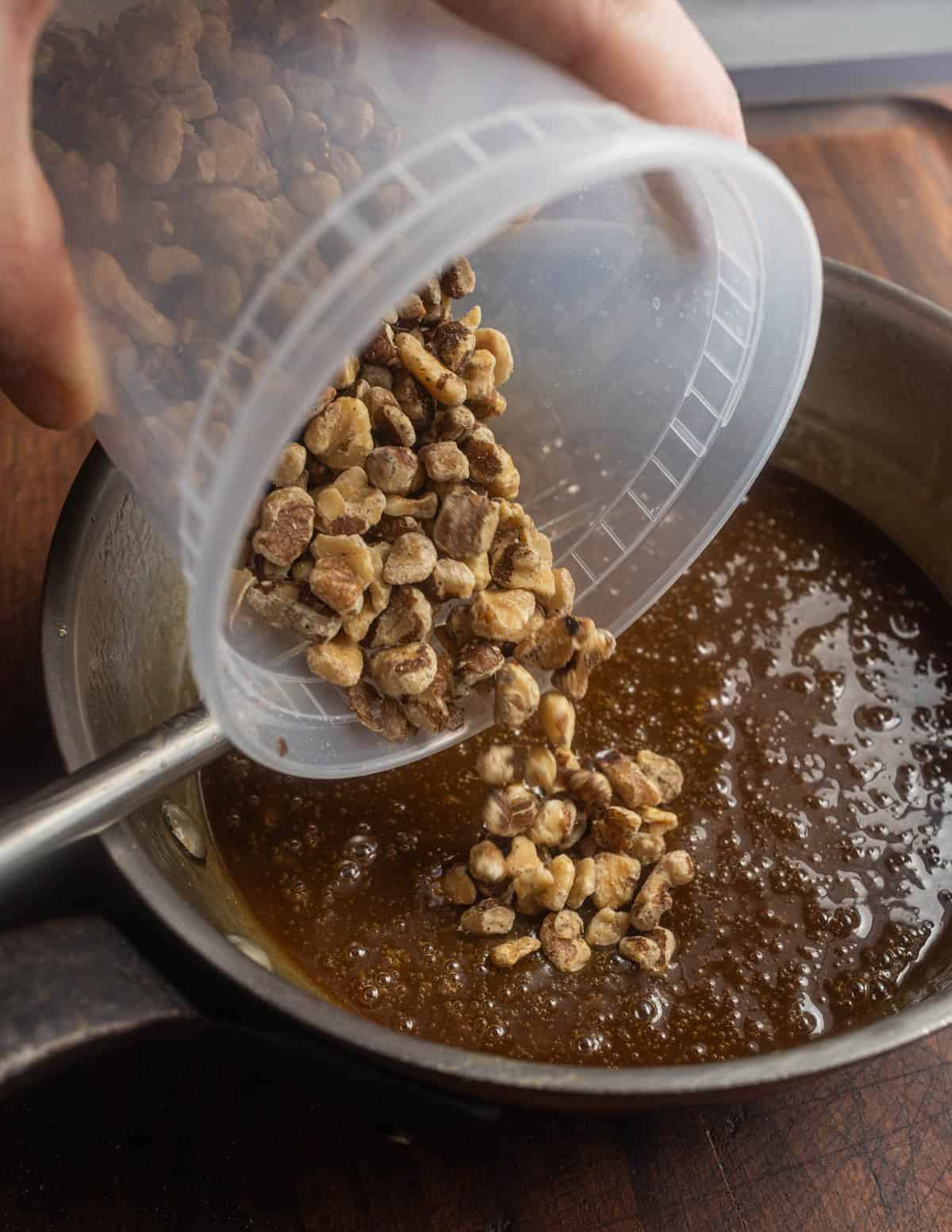 Adding walnuts to a maple custard filling for bar cookies.