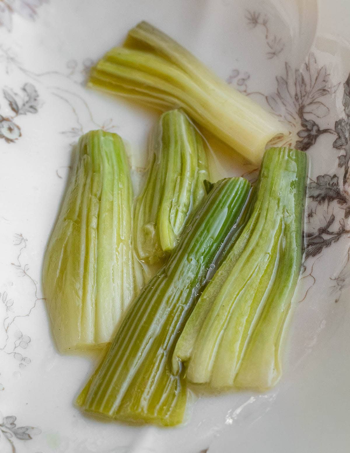 Cooked, marinated patience dock stems.