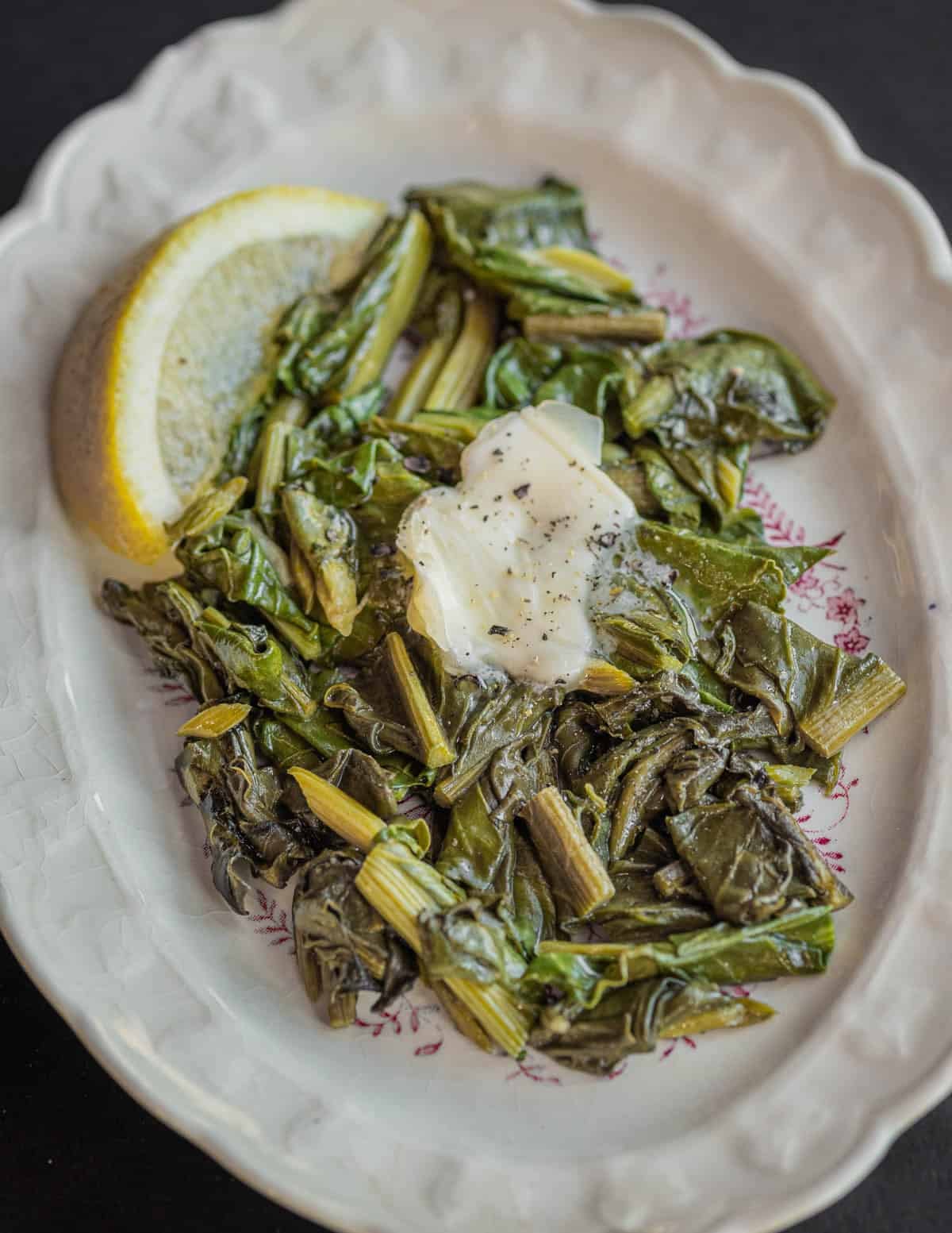 Cooked dock leaves with salt and butter.