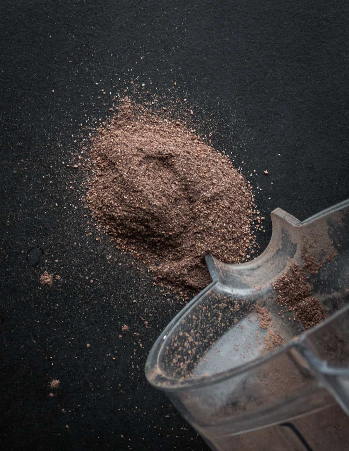 Grinding dock seed flour in a Vitamix blender.