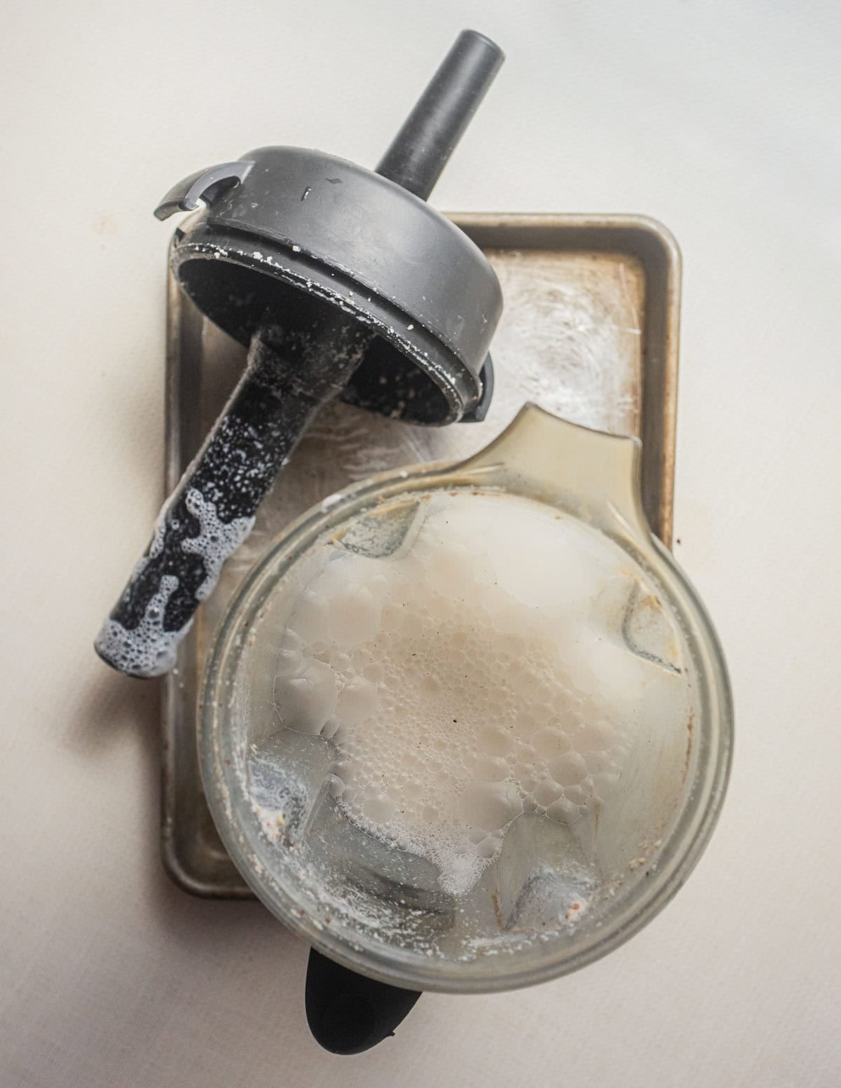 Pureeing soaked hazelnuts in a Vitamix blender to make nut hazelnut milk.