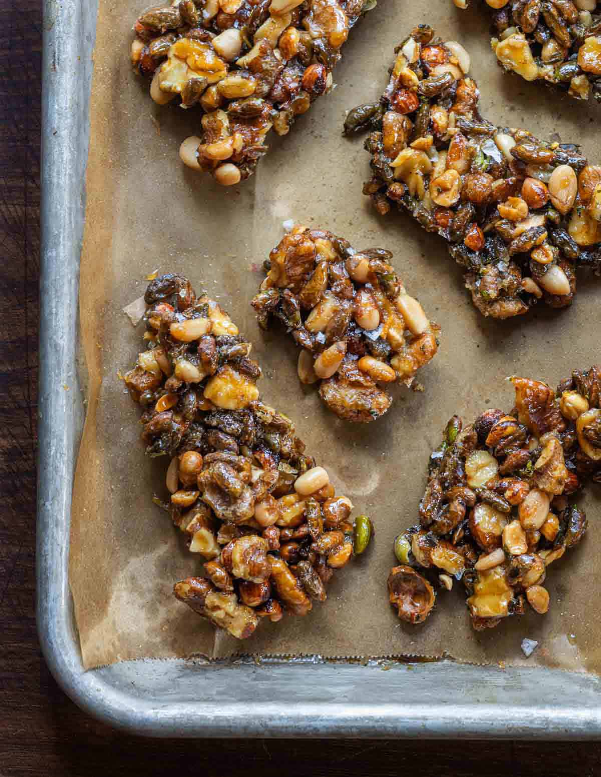 Homemade candied nut mix made with wild hazelnuts, wild pine nuts, black walnuts, sunflower seeds, and maple seeds glazed with maple syrup.