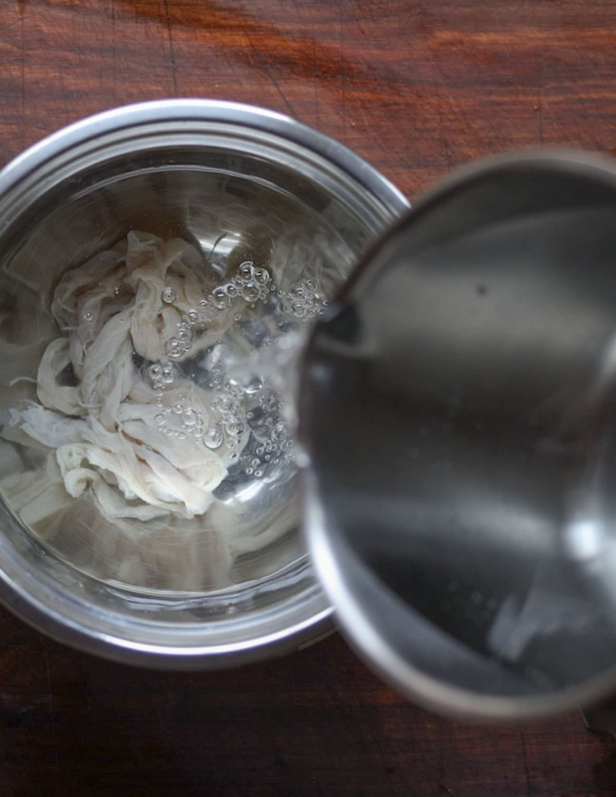 Soaking sausage casings in water to remove salt.