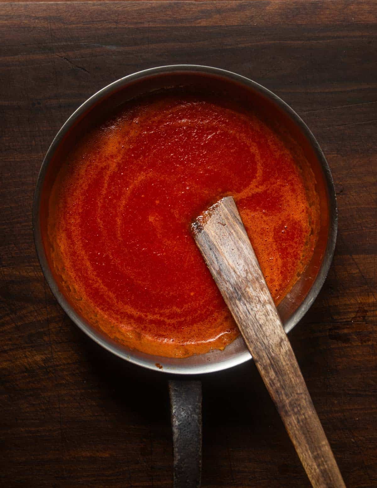 A pan of finished, red fresno fermented maple hot sauce.