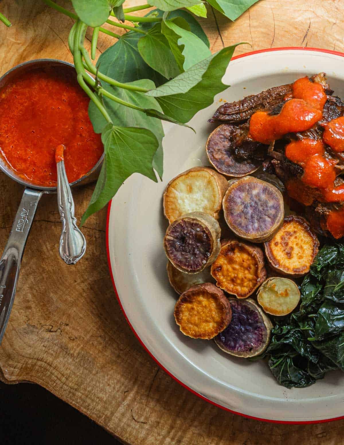 Pulled bison with maple hot sauce, sweet potatoes and their leaves.
