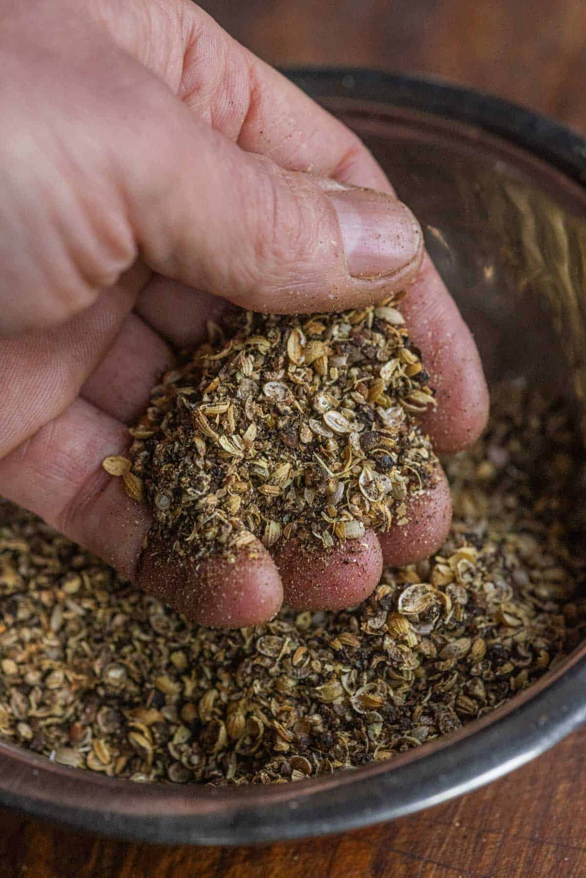 A close up image of how the texture of coarsely ground coriander and peppercorns should look.